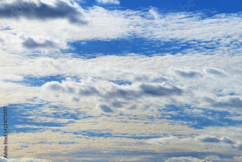 White clouds on the blue sky background