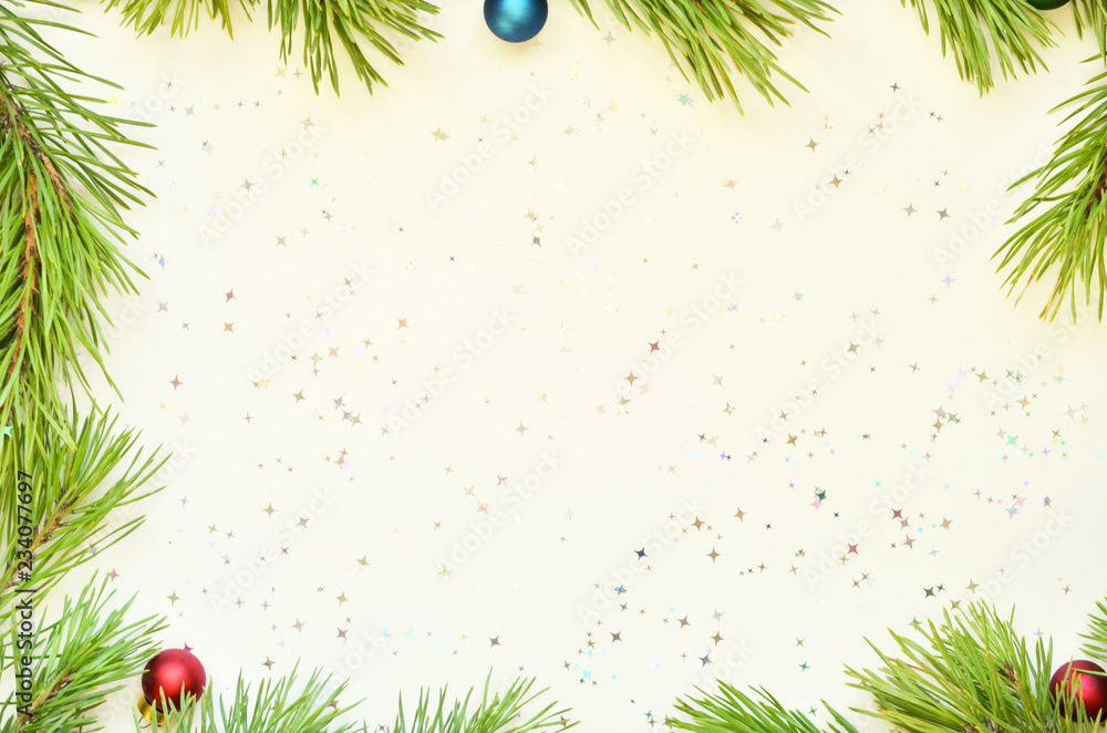 Christmas frame made from pine branch and ornaments on white background Christmas frame made from pine branch and ornaments on white background