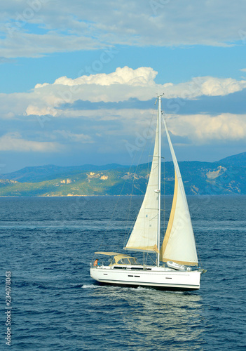Antipaxos coast a yacht sailing in the Ionian sea © Peter