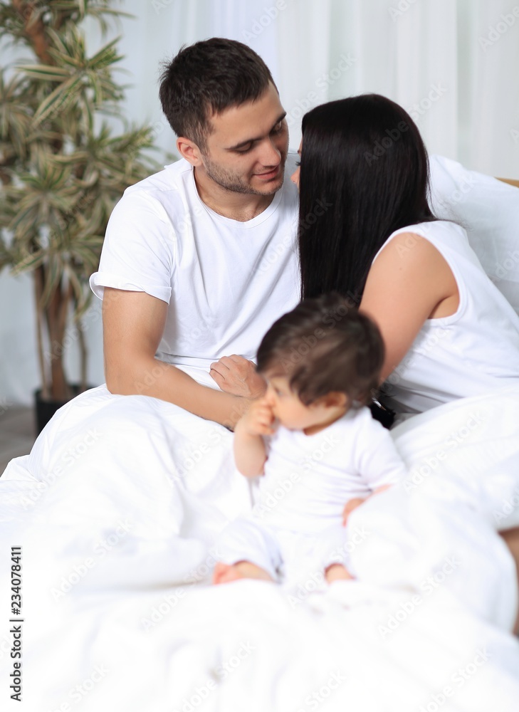 A happy young family from three persons A happy young family from three persons