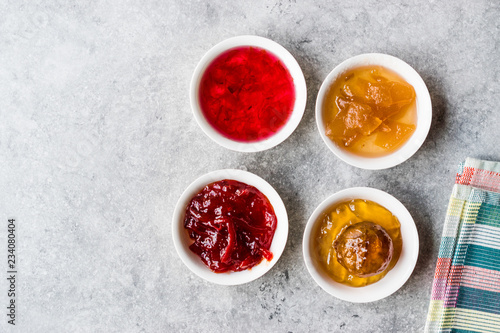 Assorted Variety of Jams and Marmalades;  Rose, Red Pepper, Mandarin and Citron Peel in Small Bowl.