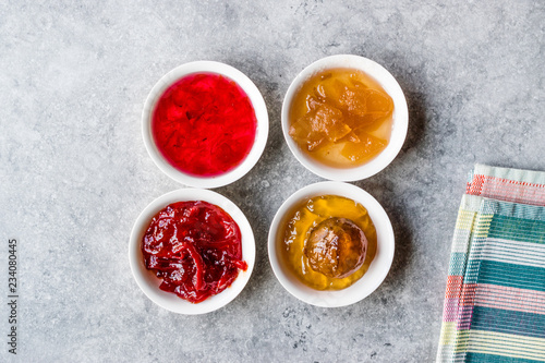 Assorted Variety of Jams and Marmalades;  Rose, Red Pepper, Mandarin and Citron Peel in Small Bowl.