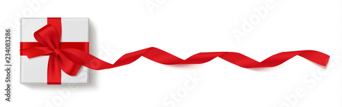 Decorative white gift box with long ribbon and red bow isolated on white background. Vector present. Top view