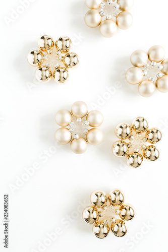 Golden Christmas decoration balls on white background. Flat lay, top view.
