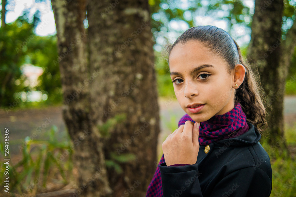 Pretty girl in black overcoat and purple scarf - Forest Park Pretty girl in black overcoat and purple scarf - Forest Park