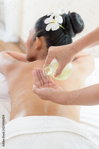woman lying down on a massage bed at a spa