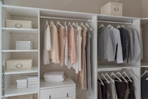 modern closet with clothes hanging