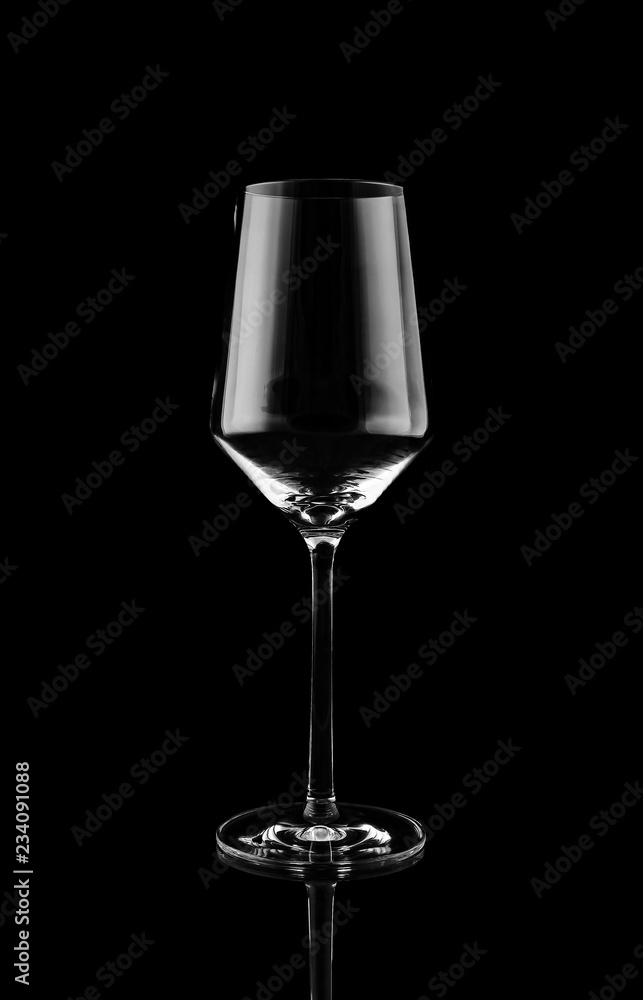 Empty tall wine glass on black background Empty tall wine glass on black background
