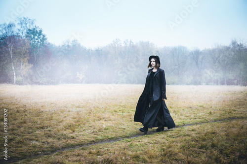 Confident woman in a black coat