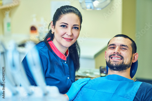 Dentist at work on a patient in clinic