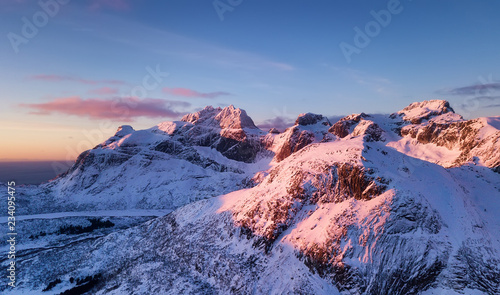 Aerial view at the Lofoten islands, Norway. Mountains during sunset. Natural landscape from air at the drone. Norway at the winter time