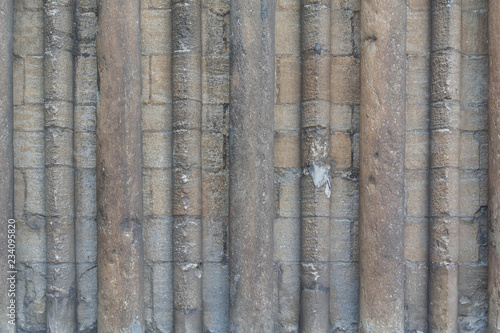 Many Old Columns on Block Wall in English 