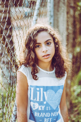 Portrait pretty girl metal fence