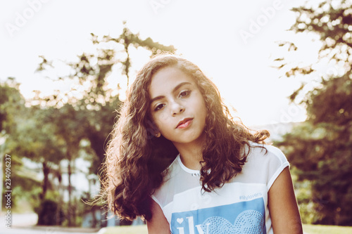 Beautiful girl smiling at sunset
