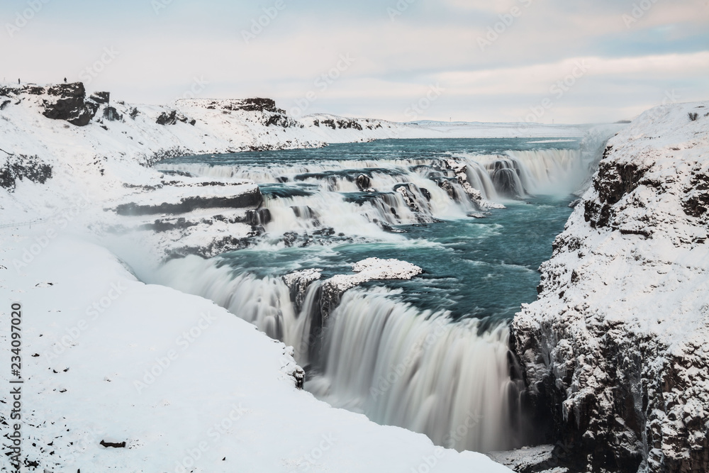 Gullfoss waterfall view in the canyon of the Hvita river during winter snow Iceland Gullfoss waterfall view in the canyon of the Hvita river during winter snow Iceland