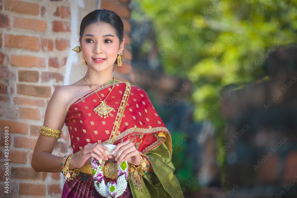 Thai girl dressed in Thai costume in the historical park