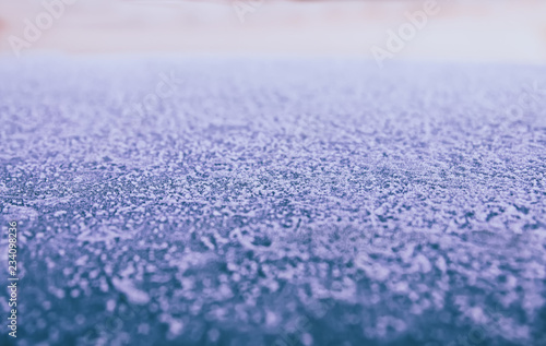 Obraz na płótnie Background: smooth metallic surface covered with thick frost and illuminated by dim morning light w salonie