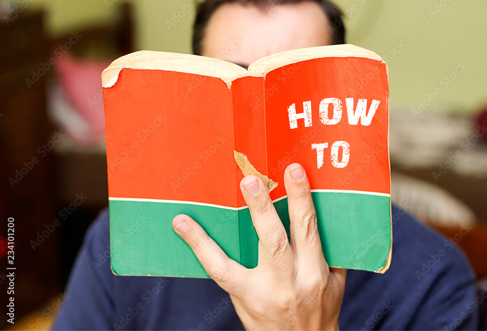person holding and readin from book with text title, how to - obrazy, fototapety, plakaty 