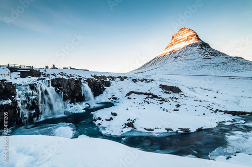 Kirkjufell view during winter snow which is a high mountain on the north coast of Iceland's Snaefellsnes peninsula, near the town of Grundarfjordur 