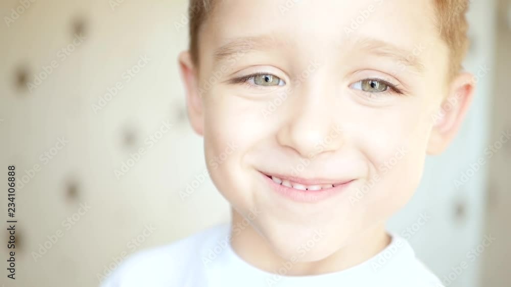 Portrait of a smiling child. The face of a happy child. Close-up. Portrait of a smiling child. The face of a happy child. Close-up.