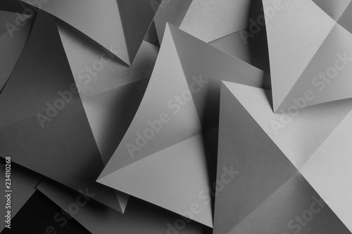 Abstract composition with gray paper folded in geometric shapes 
