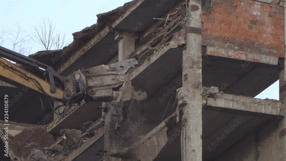 demolition of a multi-storey building with hydraulic shears, for future development of residential buildings demolition of a multi-storey building with hydraulic shears, for future development of residential buildings