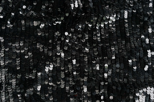 sequin texture background. Black color fabric. festive background photo