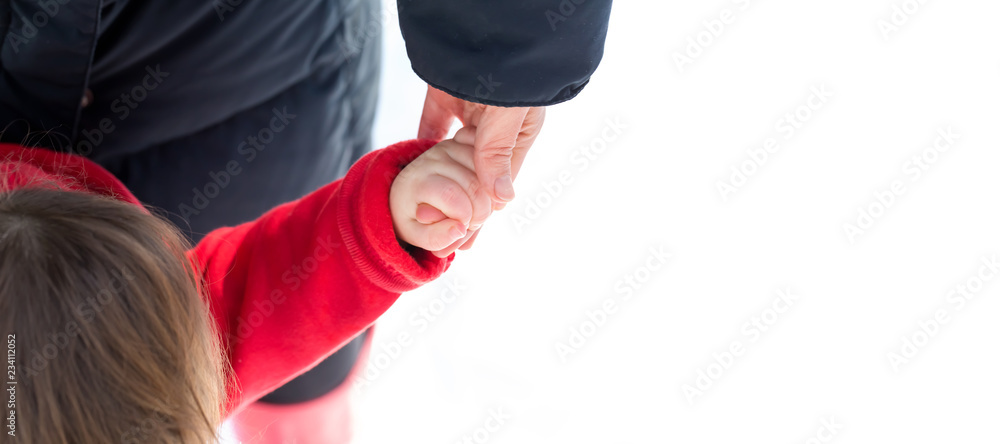 Toddler boy playing in the snow with his mother Toddler boy playing in the snow with his mother