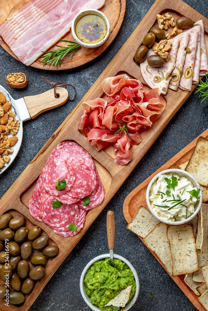 Antipasto Platter. Ham serrano, salami olive jamon dip sauces and red wine