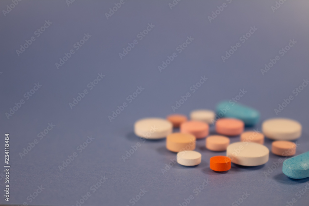 Pills of colors in a neutral background. Medications in the form of tablets. Pills of colors in a neutral background. Medications in the form of tablets.