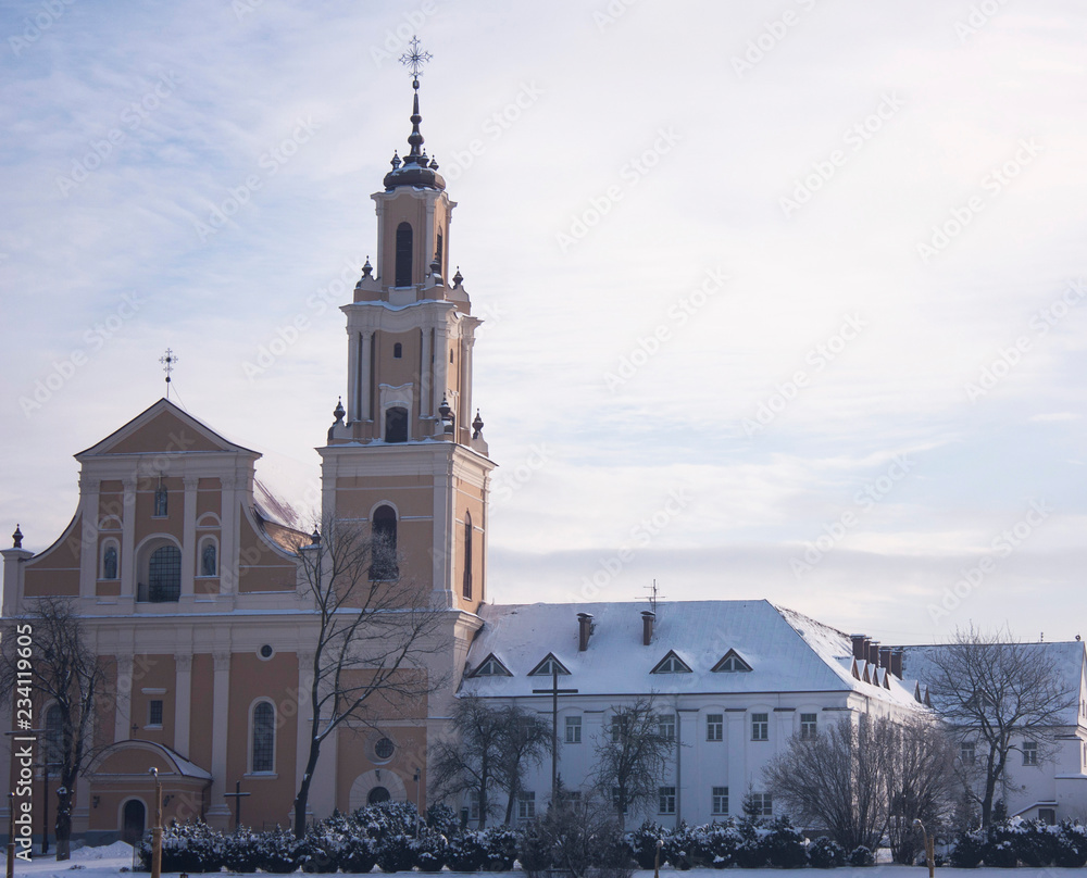 Sights and views of Grodno. Belarus. Winter day. Old Bernardine church on the background of the sky.