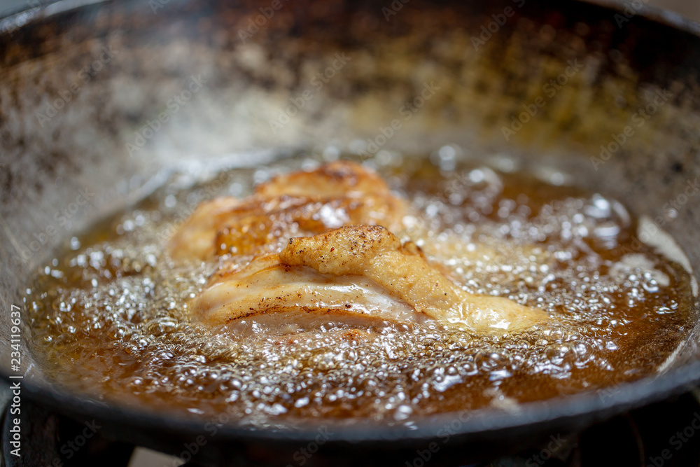 Fried chicken in hot oil and boiling in pan Fried chicken in hot oil and boiling in pan