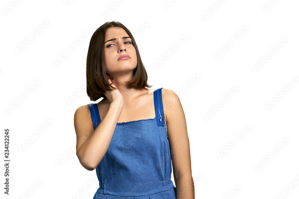 Portrait of girl suffering from neck pain. Young woman having nape pain, isolated on white background. Nerve injury concept. Portrait of girl suffering from neck pain. Young woman having nape pain, isolated on white background. Nerve injury concept.