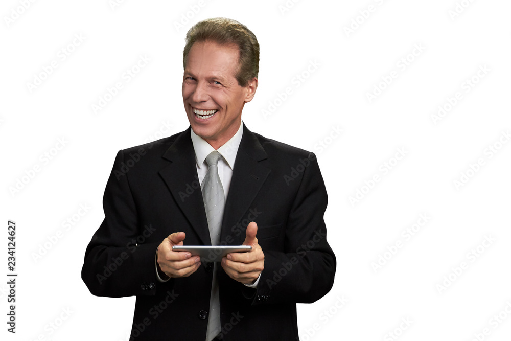 Portrait of happy businessman with smartphone. Laughing male executive holding smartphone isolated on white background with copy space. Portrait of happy businessman with smartphone. Laughing male executive holding smartphone isolated on white background with copy space.