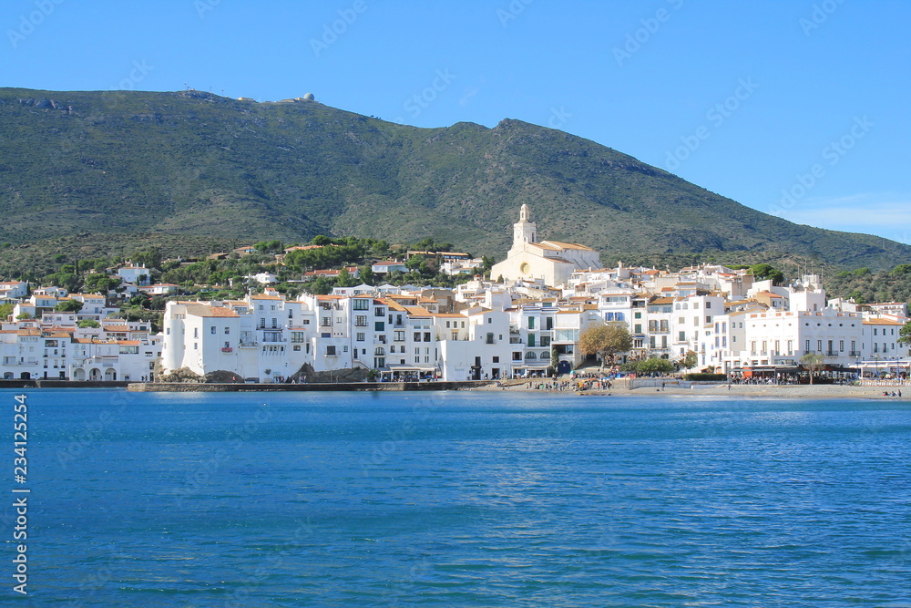 the Amazing Spain coastal village of Cadaques with a traditional boat, Mediterranean sea, the Pearl of the Costa Brava, Catalonia