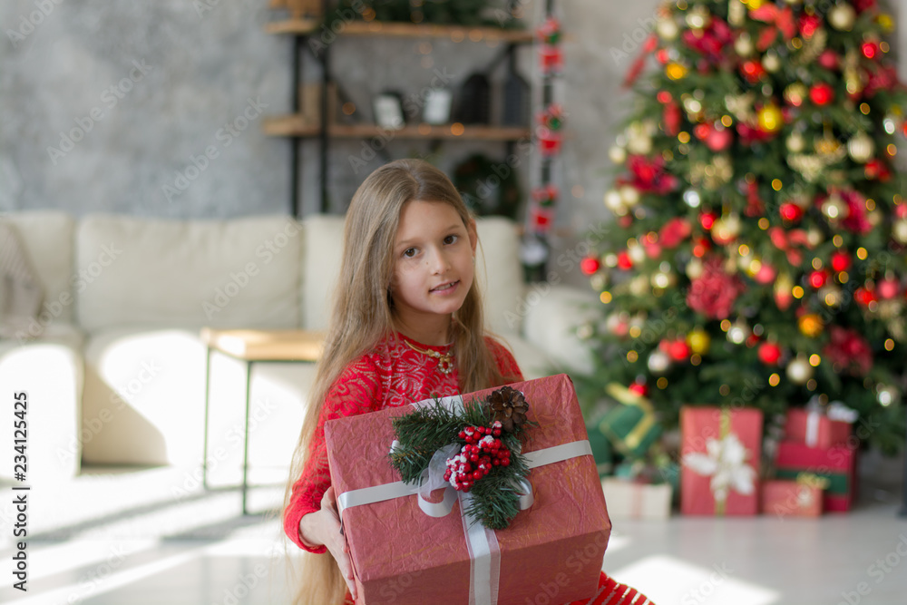 Beautiful girl near the Christmas tree with gifts Beautiful girl near the Christmas tree with gifts