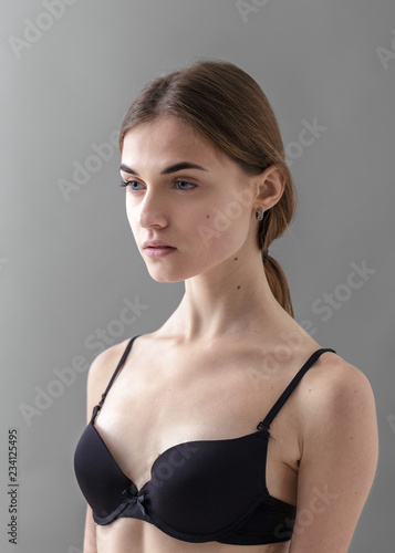 Standard model tests of young pretty woman on a gray background,Test Shots young models for modeling agency on a gray background with ,young beautiful woman in underwear. portrait of slim woman 
