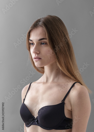 Standard model tests of young pretty woman on a gray background,Test Shots young models for modeling agency on a gray background with ,young beautiful woman in underwear. portrait of slim woman 