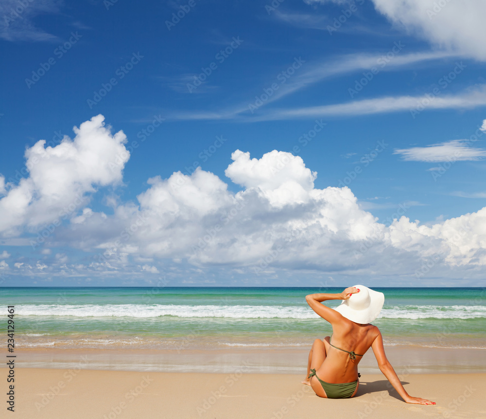 Young attractive woman relax on the sea beach Young attractive woman relax on the sea beach