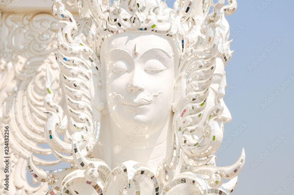 An element of the White Temple / Wat Rong Khun in Chiang Rai, north Thailand. White sculpture in traditional thai art style.