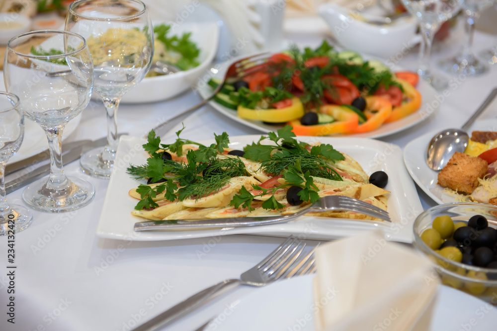 Cold dishes and snacks on the festive table. A rich luxurious meal in the restaurant. Cold dishes and snacks on the festive table. A rich luxurious meal in the restaurant.