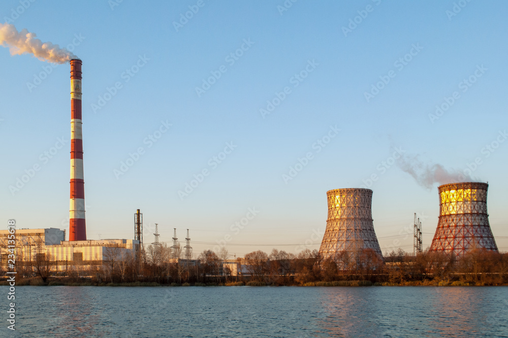 Industrial pollution. The smoke from the chimney of the industrial plant Industrial pollution. The smoke from the chimney of the industrial plant