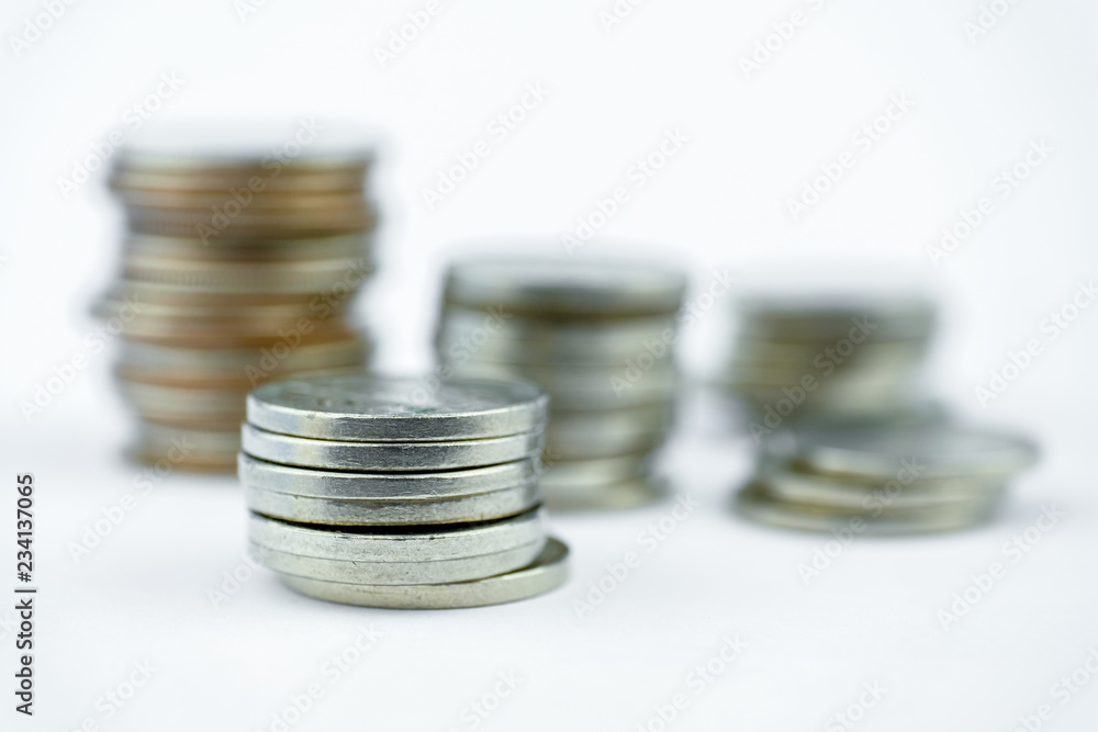 Stacks of coins on a white background. Close up. Stacks of coins on a white background. Close up.