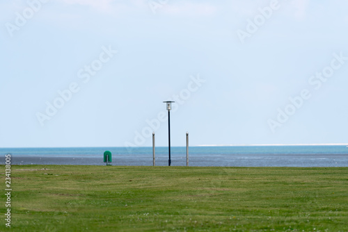 dustbin lanp and  shower at the beach  photo