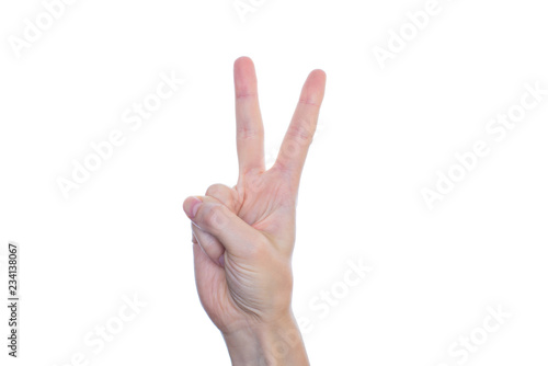 Closeup cropped studio photo of girl's hand make give show two fingers isolated on bright clean clear pure white background copyspace