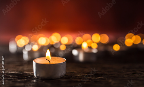 Many candles symolizing funeral religios christmas spa celebration birthday spirituality peace memorial or holiday burning at night