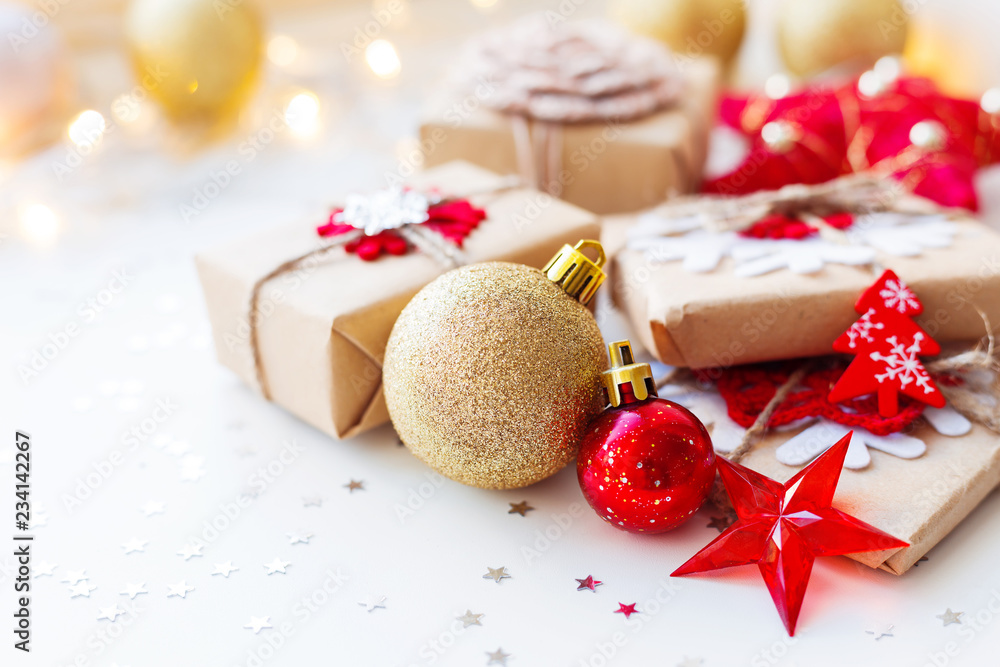 Christmas and New Year background with golden decorative ball, presents and decorations for Christmas tree. Holiday background with stars confetti and light bulbs. Place for text. Christmas and New Year background with golden decorative ball, presents and decorations for Christmas tree. Holiday background with stars confetti and light bulbs. Place for text.
