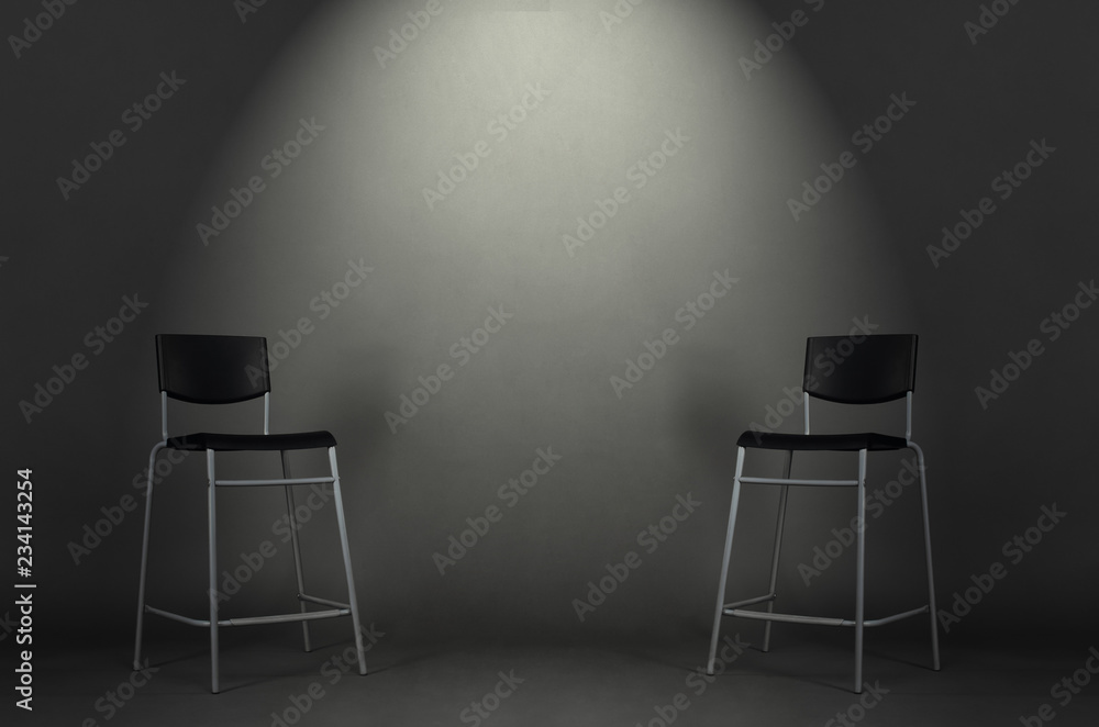 Two black chairs isolated on gray background in the studio with copy space.  Job interview room. Stock Photo | Adobe Stock
