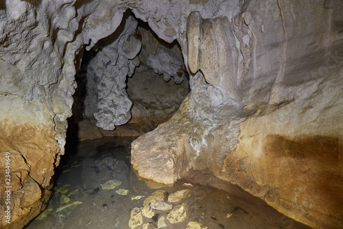 Fototapeta Naklejka Na Ścianę i Meble -  Cave with a lake inside