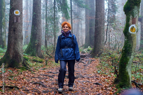 Hiker lady on a marked trail